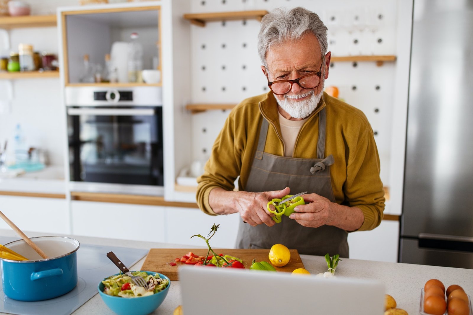 mature-handsome-man-cooking-in-home-kitchen.jpg