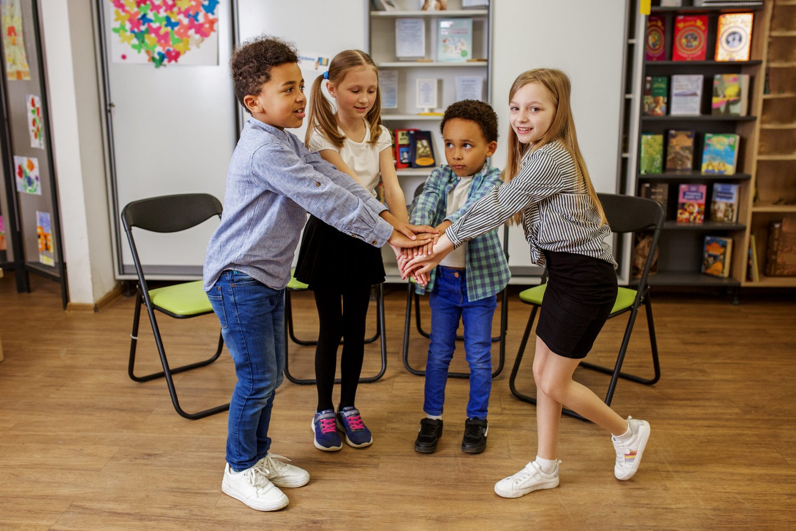 Back to school. Little school friends develop social skills and support each other. Concept of studying and education, friendship and childhood.
